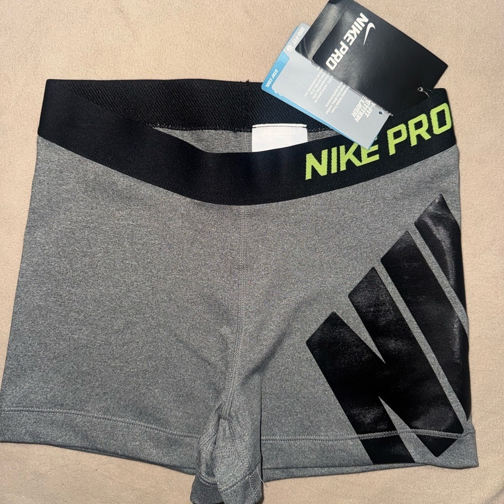 Nike Women's Gray Athletic Shorts with Black Waistband and Neon Green Logo
